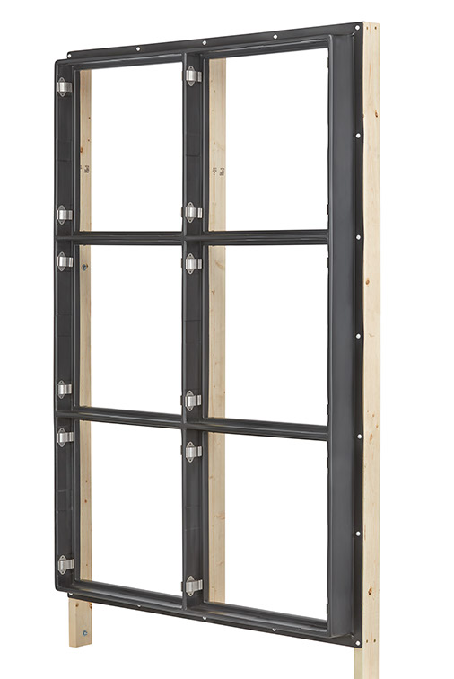 Filter grid mounted to lumber wall framing, seen at an angle